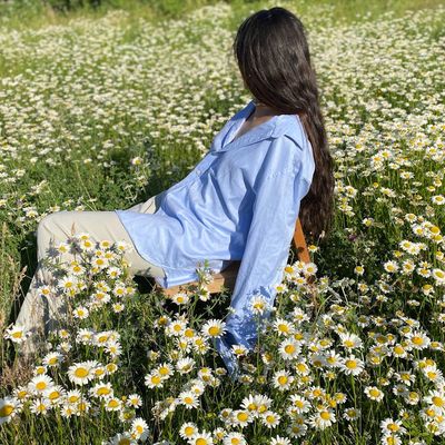 A person stretching gently in a calm environment.